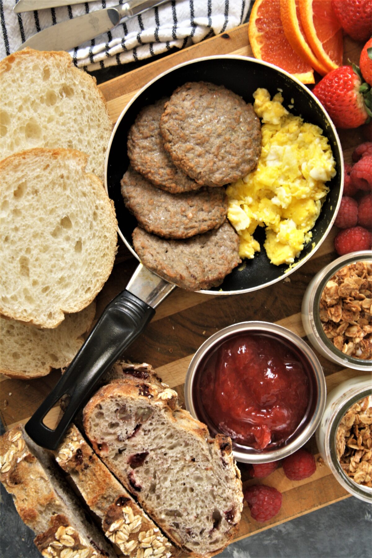 Take your next breakfast or weekend brunch to the next level and serve this fun, delicious, and beautiful breakfast grazing board with a variety of favorite breakfast foods.