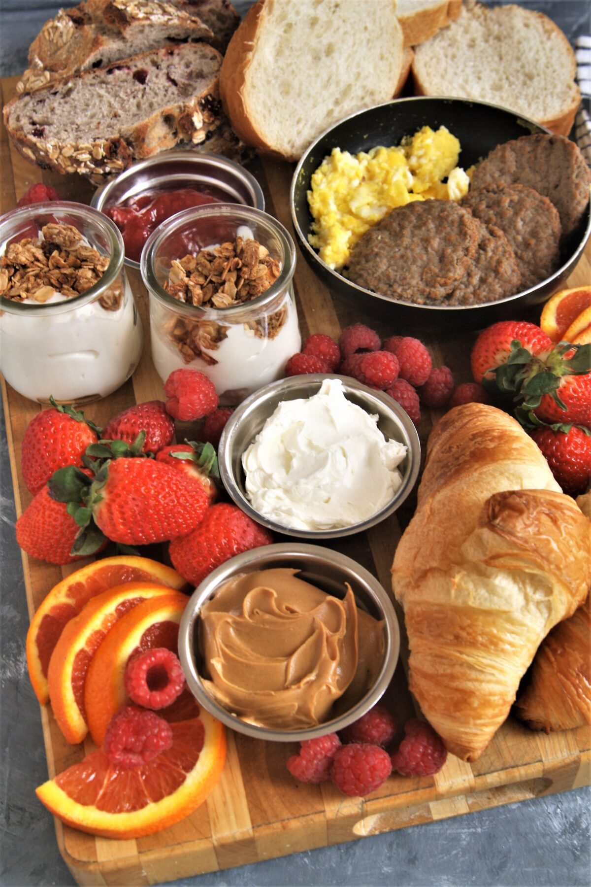 Take your next breakfast or weekend brunch to the next level and serve this fun, delicious, and beautiful breakfast grazing board with a variety of favorite breakfast foods.