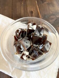 Get your caffeine fix in with Japanese coffee jelly, a refreshing dessert inspired by the anime show "The Disastrous Life of Saiki K" which combines rich coffee flavor with a silky smooth jelly texture.