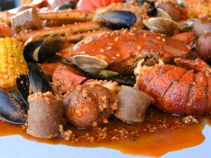 Learn how to make a delicious Angry Crab Shack-inspired seafood boil at home, featuring Cajun seasoning, Asian spices, and their signature Trifecta Sauce for a flavorful dining experience perfect for any occasion.