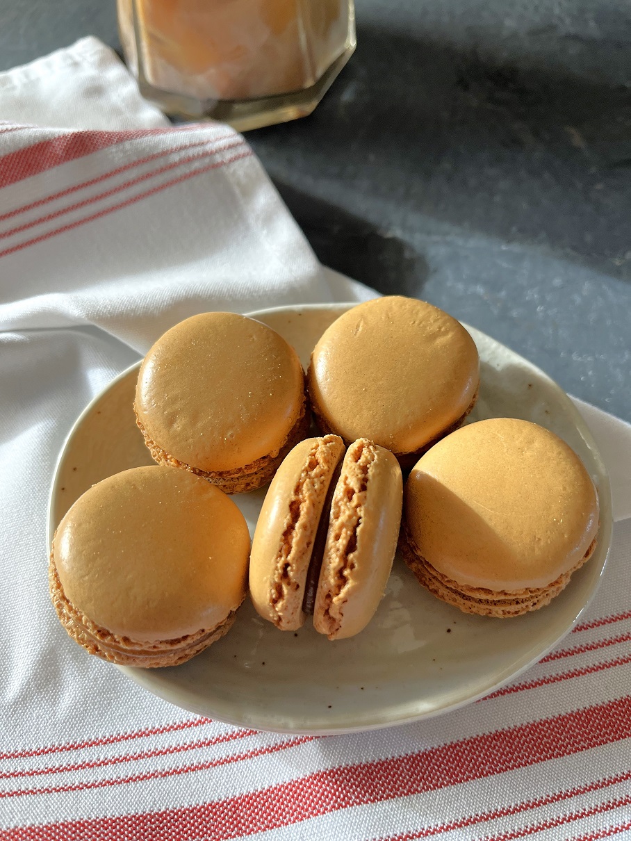 This easy coffee macaron recipe with espresso buttercream is perfect for coffee lovers, combining a rich coffee flavor with the delicate texture of French macarons.