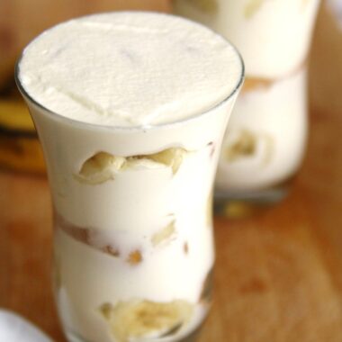 This homemade version of the iconic Copycat Magnolia Bakery Banana Pudding dessert layers Nilla wafers, fresh bananas, and a rich whipped cream mixture, creating a mouthwatering treat perfect for any occasion.