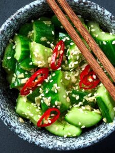 Make the famous crisp, spicy, and tangy Din Tai Fung cucumber salad at home with this easy copycat recipe. Made with Persian cucumbers, garlic, sesame oil, and chili oil—it's perfect as a refreshing side dish or appetizer!