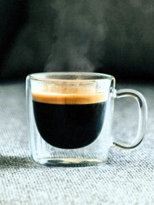 Learn how to make Cafézinho, Brazil’s traditional sweet and strong coffee. This simple recipe uses dark roast coffee, sugar, and a cloth filter for a bold brew served in a small cup.