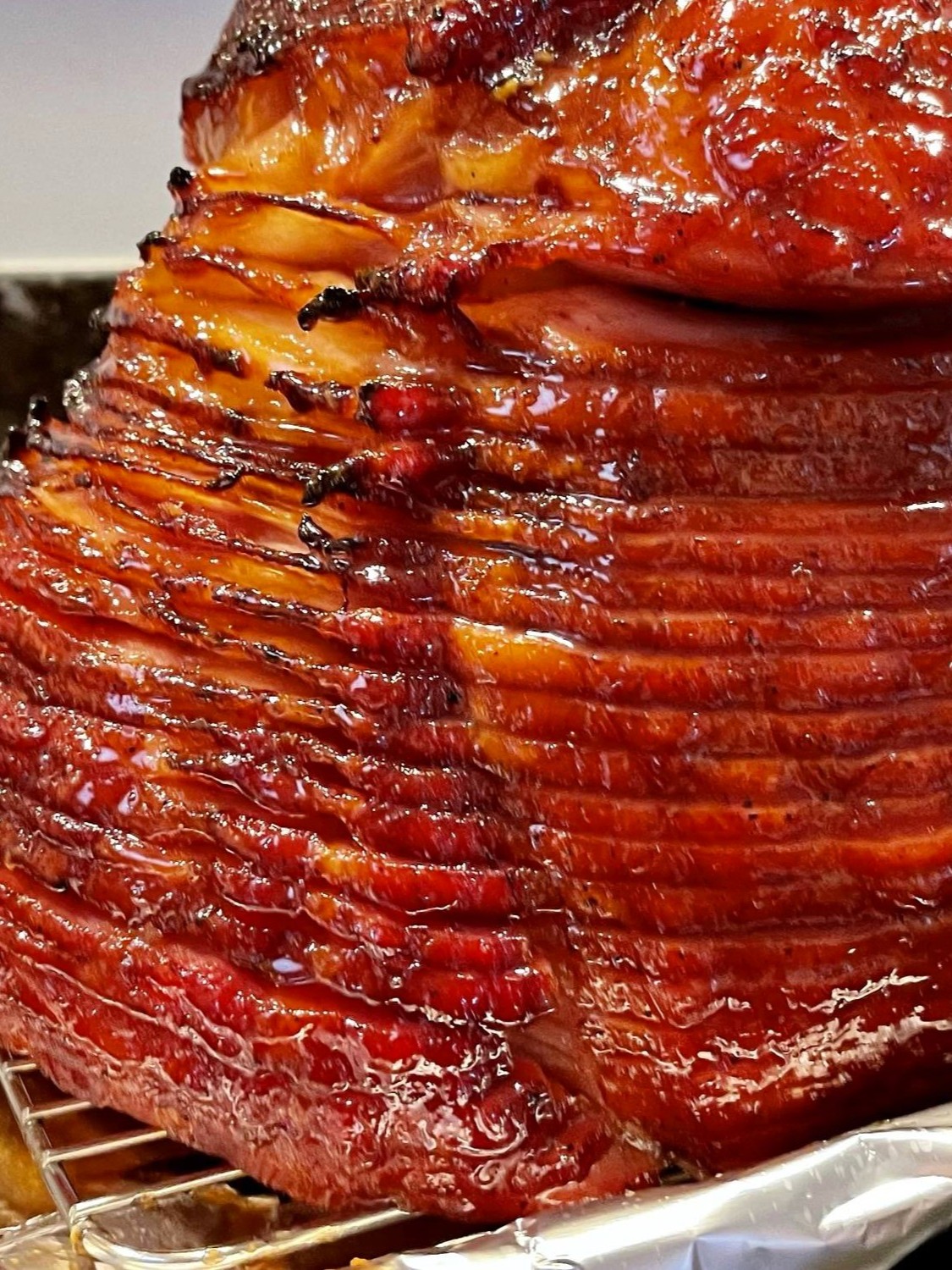 Learn how to cook a spiral sliced ham with a rich, homemade glaze — the perfect centerpiece for your next holiday meal or special occasion.
